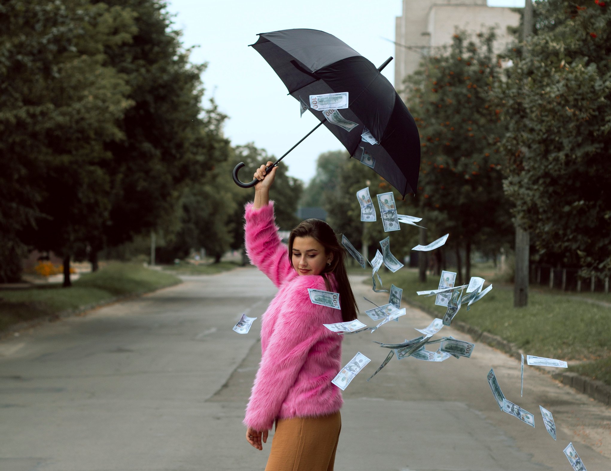 A Woman in a Pink Fur Coat with Falling Money